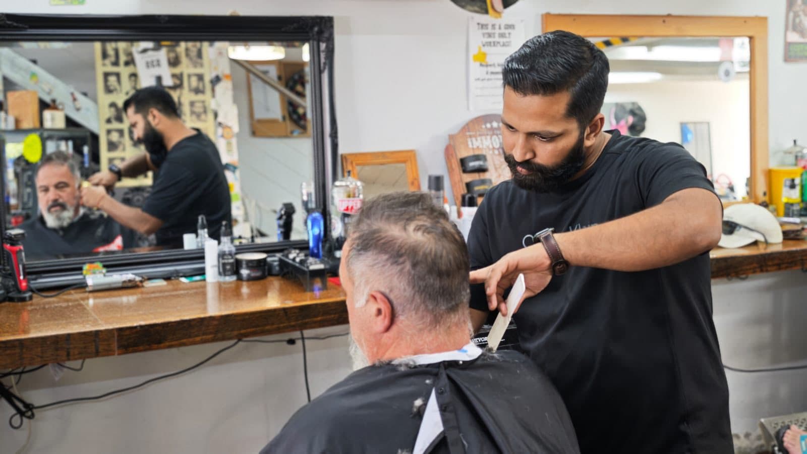 Inside High St Barber — mirrors, classic interior, working barber